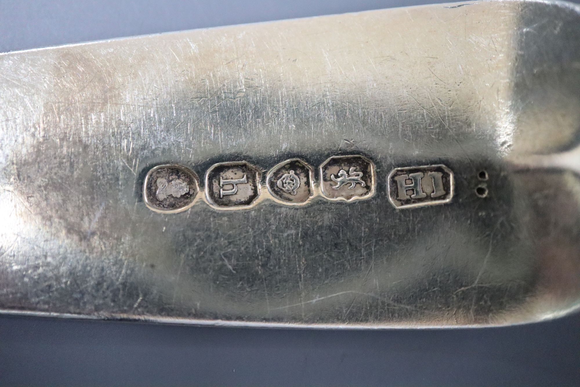 A group of assorted 19th century silver flatware including two caddy spoons (one Scottish) and a napkin ring,